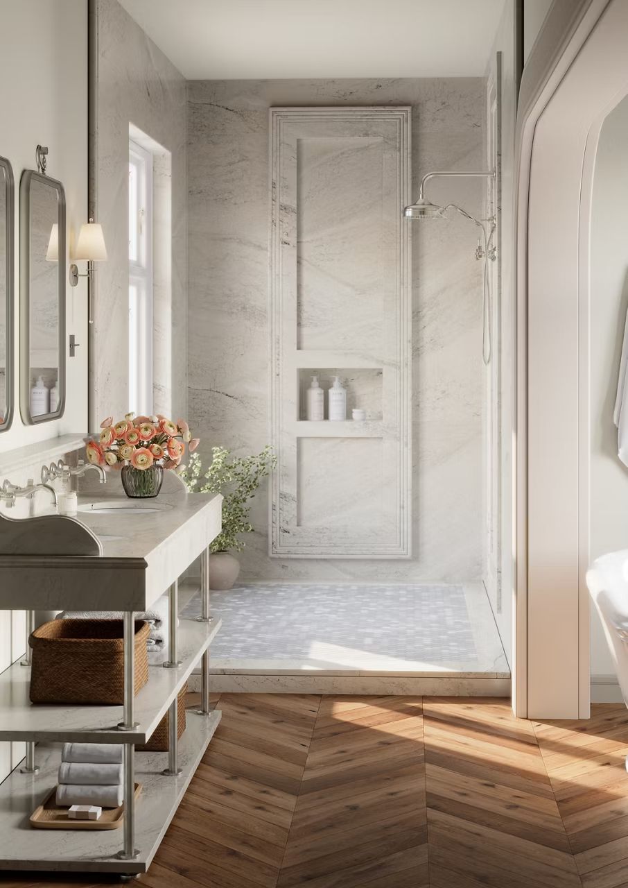 Marble shower with wood herringbone floor